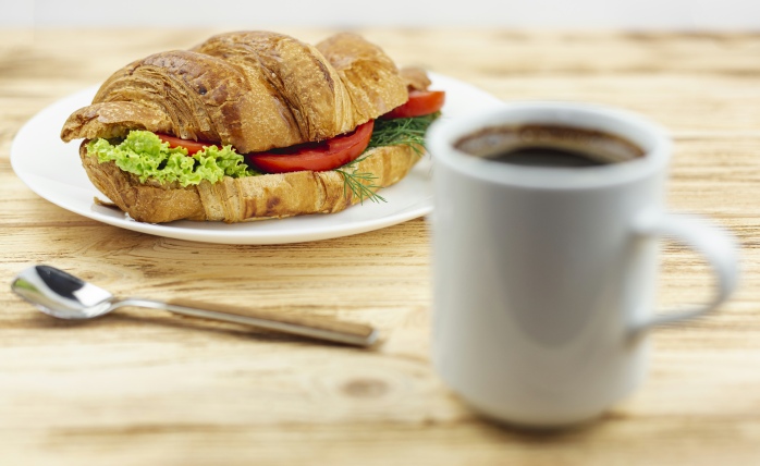 Croissant and coffee cup to support Catering information